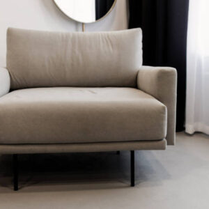 Cozy cabinet with chair in light room interior